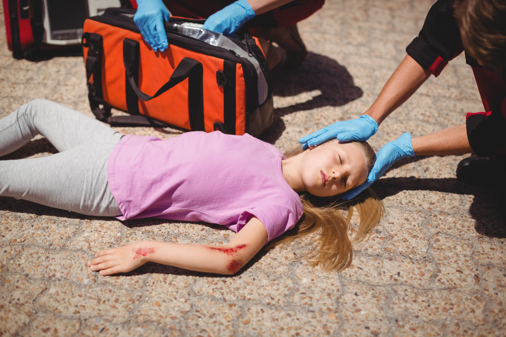 paramedics-examining-injured-girl Personal injury